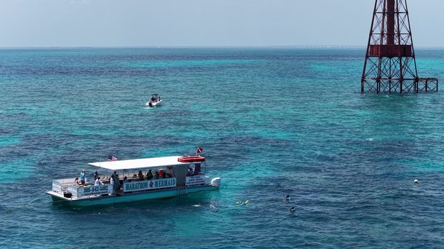 Aerial view of the Marathon Mermaid catamaran over the turquoise waters of the reef